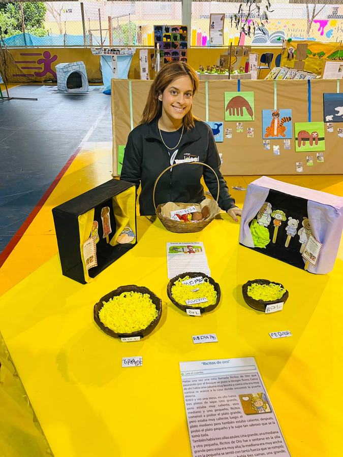 Beatriz at the school exhibition with story boxes